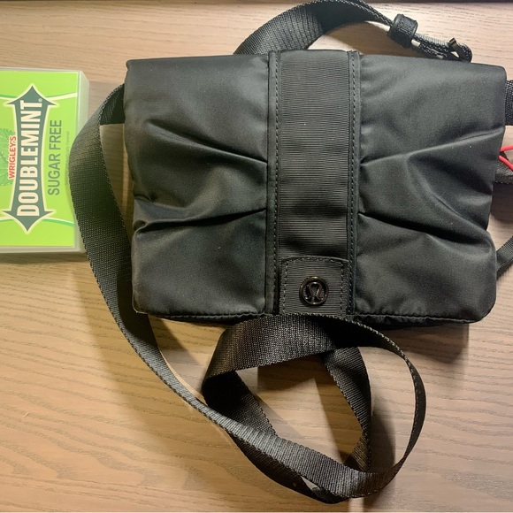 New no tags. Lululemon small Crossbody bag. 4 pockets. Clear phone pocket. - Picture 2 of 5